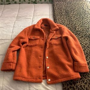 An orange fur coat/jacket